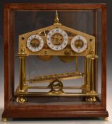 Devon Clocks Congreve rolling ball clock, the three enamelled chapter rings with Arabic numerals,