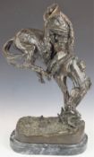 A large bronze mounted figure 'The Outlaw', impressed 'Frederic Remington' (American 1861-1909),