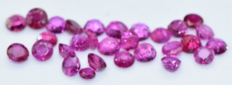 Twenty-nine loose round cut natural unheated Burmese rubies, total carat weight approximately 5.