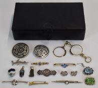 A collection of jewellery including brooches. Edwardian silver brooch with applied gold