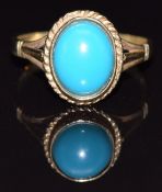 A 9ct gold ring set with a faux turquoise cabochon, size N, 2.4g