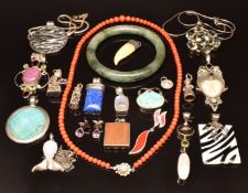 A jadeite bangle, coral beaded necklace, eleven silver pendants set with turquoise, ruby, quartz,
