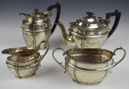 George V hallmarked silver four piece tea set comprising teapot, hot water jug, sugar bowl and