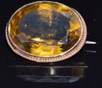 A c1910 9ct gold brooch set with a large oval cut citrine, 9g