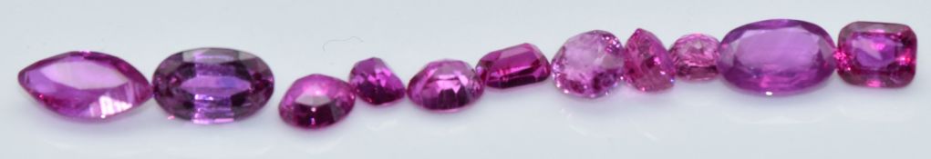 Eleven loose round, marquise, oval and emerald cut natural unheated Burmese rubies, total carat