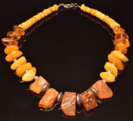 A silver and Baltic amber necklace by Lola Martin, with original box and receipt
