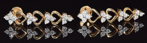 A pair of 18ct gold earrings set with diamonds with heart decoration, 7g