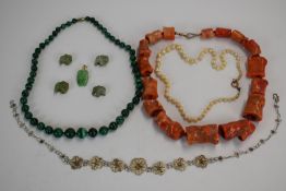 A collection of necklaces to include coral with 9ct gold clip clasp, malachite and filigree
