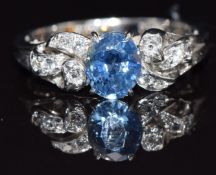 A 14k white gold ring set with an oval sapphire and zircons, size J, 2.5g