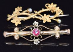 A 15ct gold brooch in the form of ivy set with two pearls with textured detail and a 9ct gold brooch