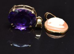 A 14k gold pendant set with an amethyst and a 14k gold pendant set with a faux cameo, 3g