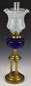 19thC blue glass oil lamp with triple reeded column support and frilled opaque glass shade, H66cm