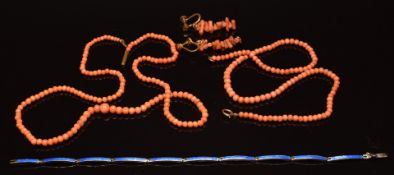Two coral necklaces, a pair of coral earrings and a silver bracelet set with blue enamel