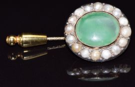 Victorian stick pin set with an oval cut agate surrounded by split pearls, 11.1g