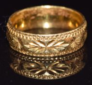 A 22ct gold wedding band/ ring with cut out decoration, size K, 4.3g