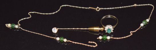 A 9ct gold stick pin, 9ct gold ring set with an emerald and cubic zirconia, and 9ct gold necklace