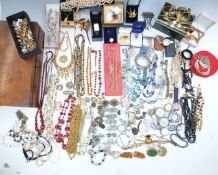 A collection of costume jewellery including pearl bracelets, vintage brooches including Sphinx,