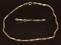 A silver guard chain with alternating gilt and silver links