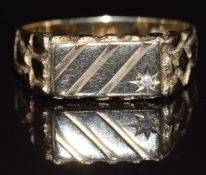 A 9ct gold signet ring set with a diamond, size V, 5.4g