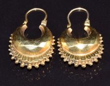 A pair of 9ct gold earrings with faceted decoration, 1.8g