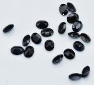 Twenty loose oval cut sapphires, total approximately 8.73cts