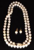 A single strand of cultured pearls with 9ct gold clasp and a pair of 9ct gold earrings set with a
