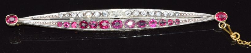 Victorian brooch of elongated boat shape set with diamonds and rubies, each end set with a further