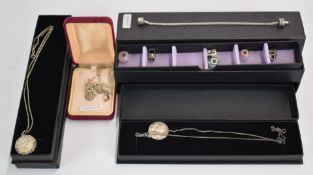 Three silver St Christophers and a silver charm bracelet