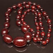 A single strand of graduated cherry amber beads, 68g