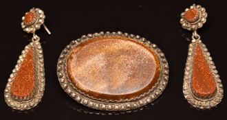 A pair of Victorian earrings set with sunstone within a cut steel border, and a similar brooch