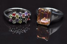 Two 9ct white gold rings, one set with treated topaz the other with sapphires, size N, 7.7g