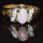 A 9k gold ring set with opal and diamond, size P, 3.1g