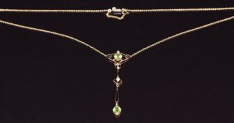 Edwardian 9ct gold necklace set with a round and oval cut peridot and seed pearls with barrel clasp,