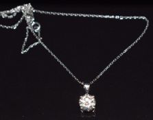 A 14k white gold pendant set with a round cut moissanite (1.1g) on 18ct white gold chain (length