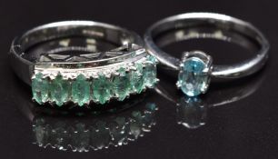 A 9ct white gold ring set with emeralds and a 9ct gold ring set with an aquamarine, size N, 5.5g