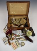 A collection of items including badges, penknives etc, in a mahogany box