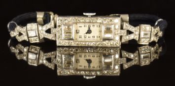 Art Deco platinum diamond set ladies wristwatch with blued hands, black Arabic numerals, silver dial