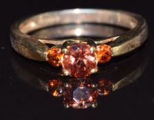 A 9k gold ring set with andesine and garnet, size N, 2.6g