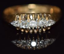 An 18ct gold set with five diamonds, in antique box, size M, 2.7g