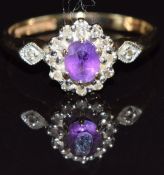 A 9ct gold ring set with an amethyst and diamonds, size K, 1.8g