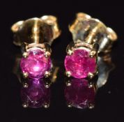 A pair of 18ct gold earrings set with natural unheated Burmese rubies (total 0.53cts) with GCS