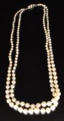 A double strand of pearls with 9ct white gold clasp set with split pearls