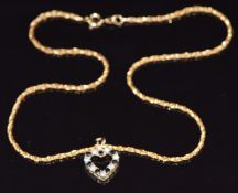 A 9ct gold rose twist necklace and a 9ct gold pendant set with sapphires and cubic zirconia, 5.8g