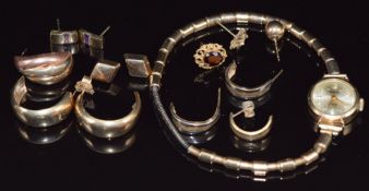 A 9ct gold watch and four pairs of 9ct gold earrings and single 9ct gold earrings (5.8g)