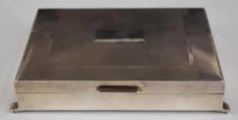 Elizabeth II hallmarked silver cigarette box with engine turned decoration and raised on four