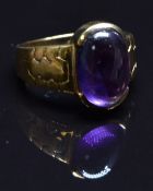 A 9ct gold ring set with an amethyst cabochon, size N, 8.3g