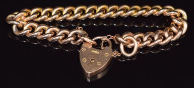 A 15ct rose gold curb link bracelet with heart padlock/ clasp, in original box, 22.7g