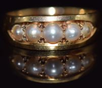 A late Victorian 18ct gold ring set with split pearls, in antique box, size M, 3.8g