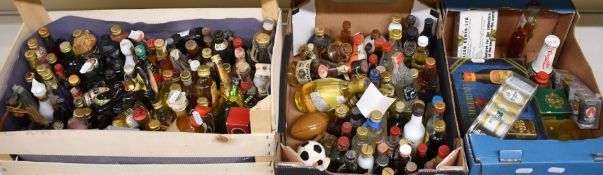 A collection of alcohol miniatures including Bell's Whisky, Graham's Port, Smirnoff Vodka, St