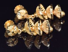A pair of 22k gold earrings in a pierced tiered design, 7.6g